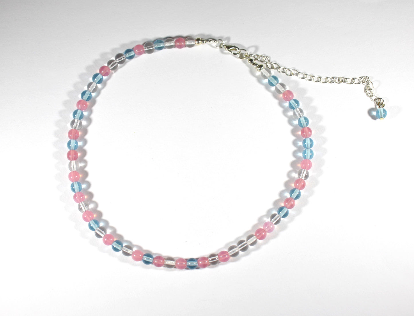 Glass bead choker necklace pink, light blue and bright colors. Beads are 6 mm. Lasihelmi choker (kaulapanta) kaulakoru. Monivärinen, jossa värit ovat vaaleanpunainen (pinkki), vaaleansininen ja kirkas. Helmet ovat 6 mm kokoisia.
