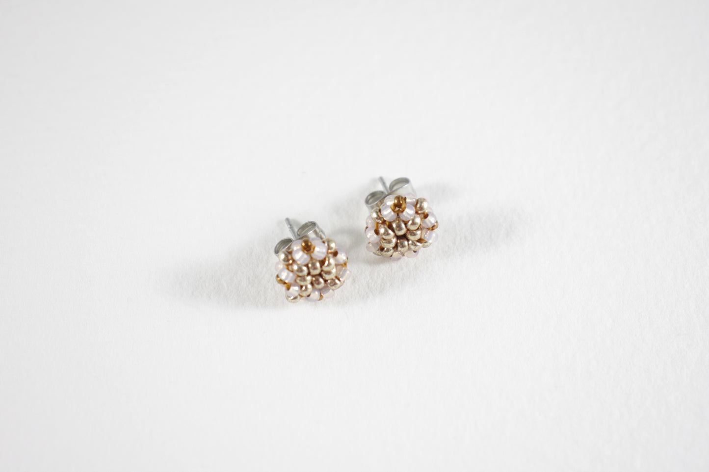 Glass bead stud earrings champagne and silver colors with stainless steel stud.