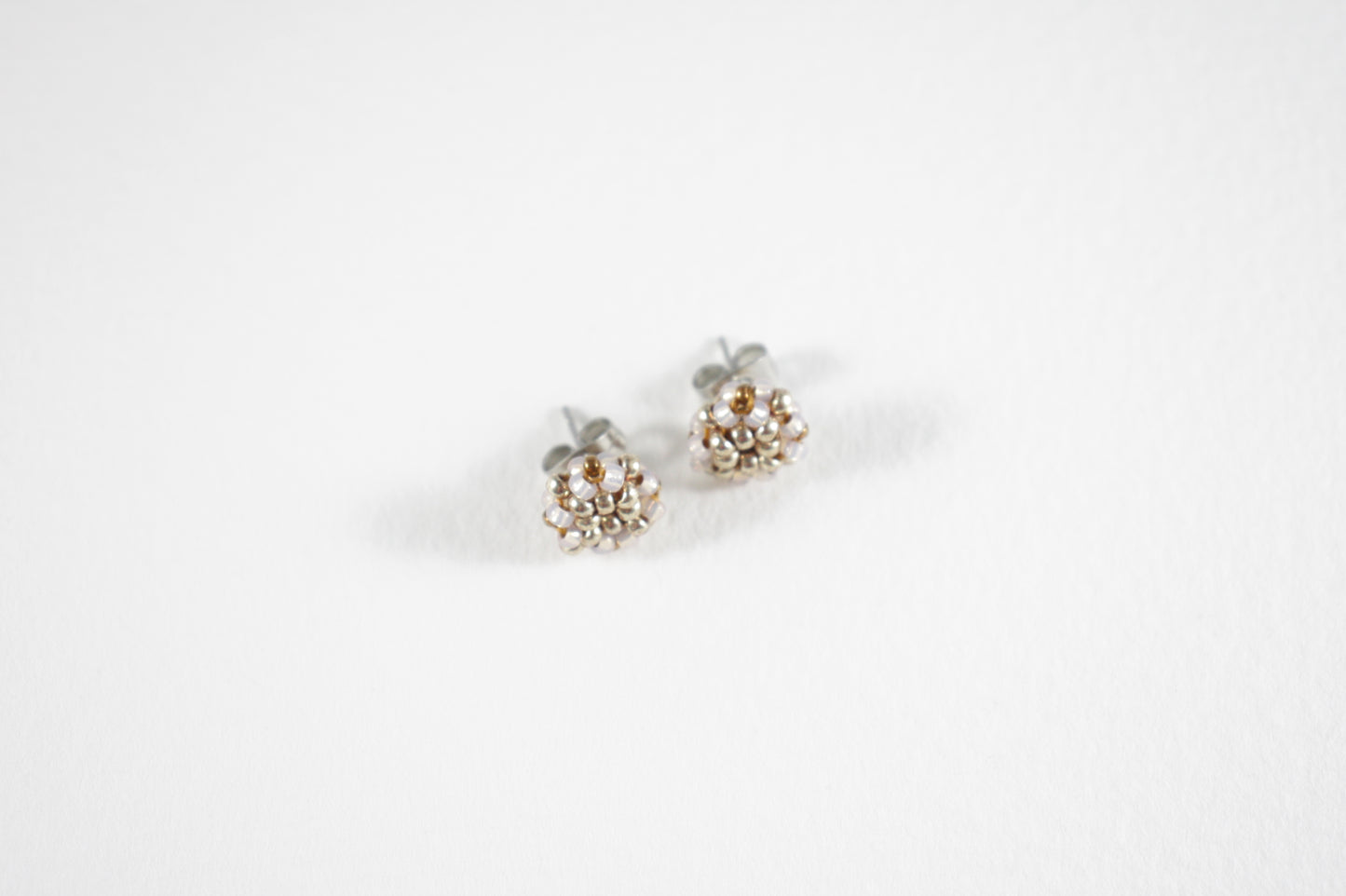 Glass bead stud earrings champagne and silver colors with stainless steel stud.