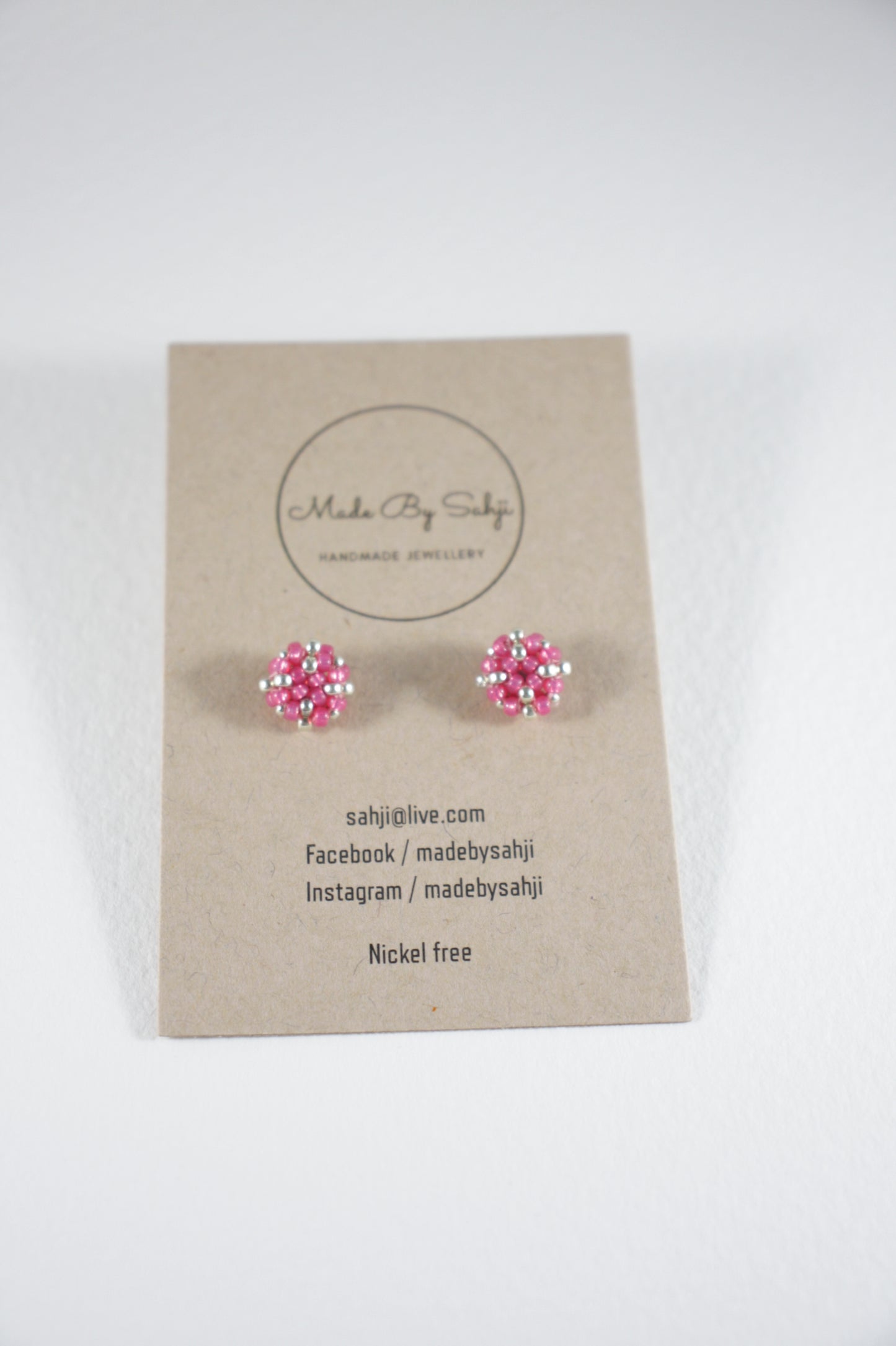 Seed bead stud earrings raspberry pink and silver color with stainless steel stud.