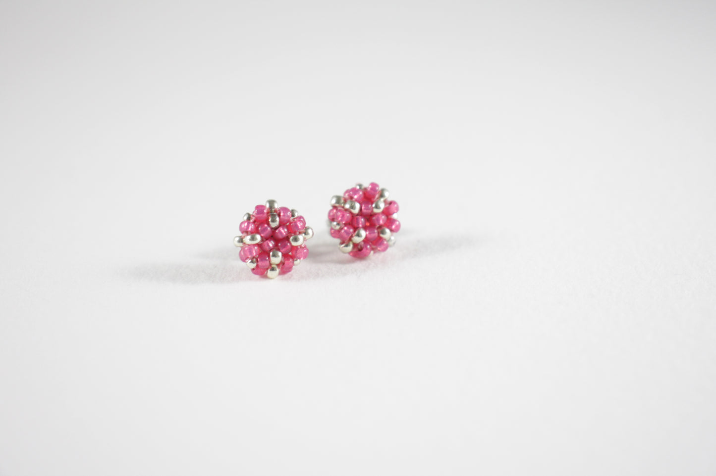 Seed bead stud earrings raspberry pink and silver color with stainless steel stud.