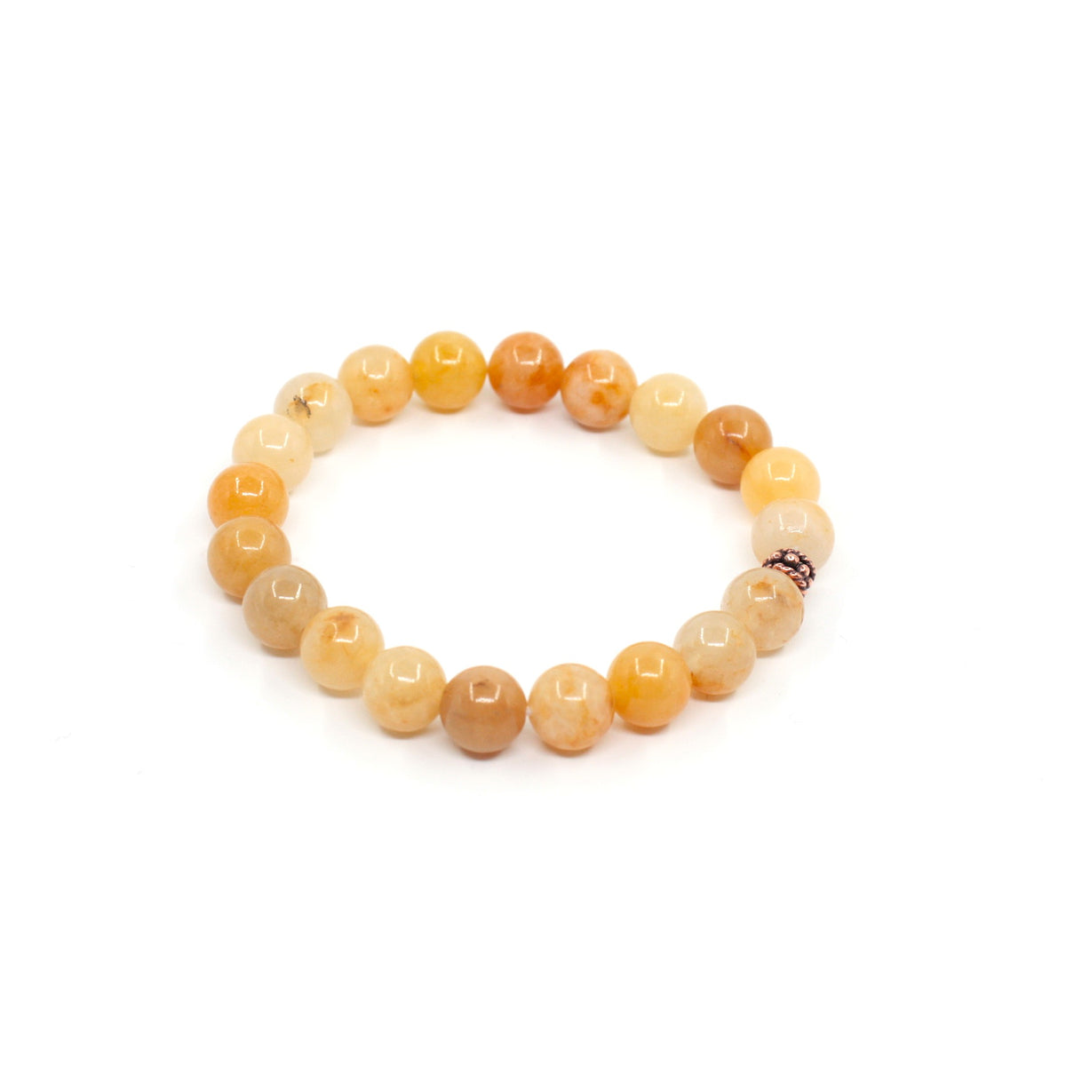Keltainen jade rannekoru valkoisella alustalla. Yellow jade bracelet on a white surface. 