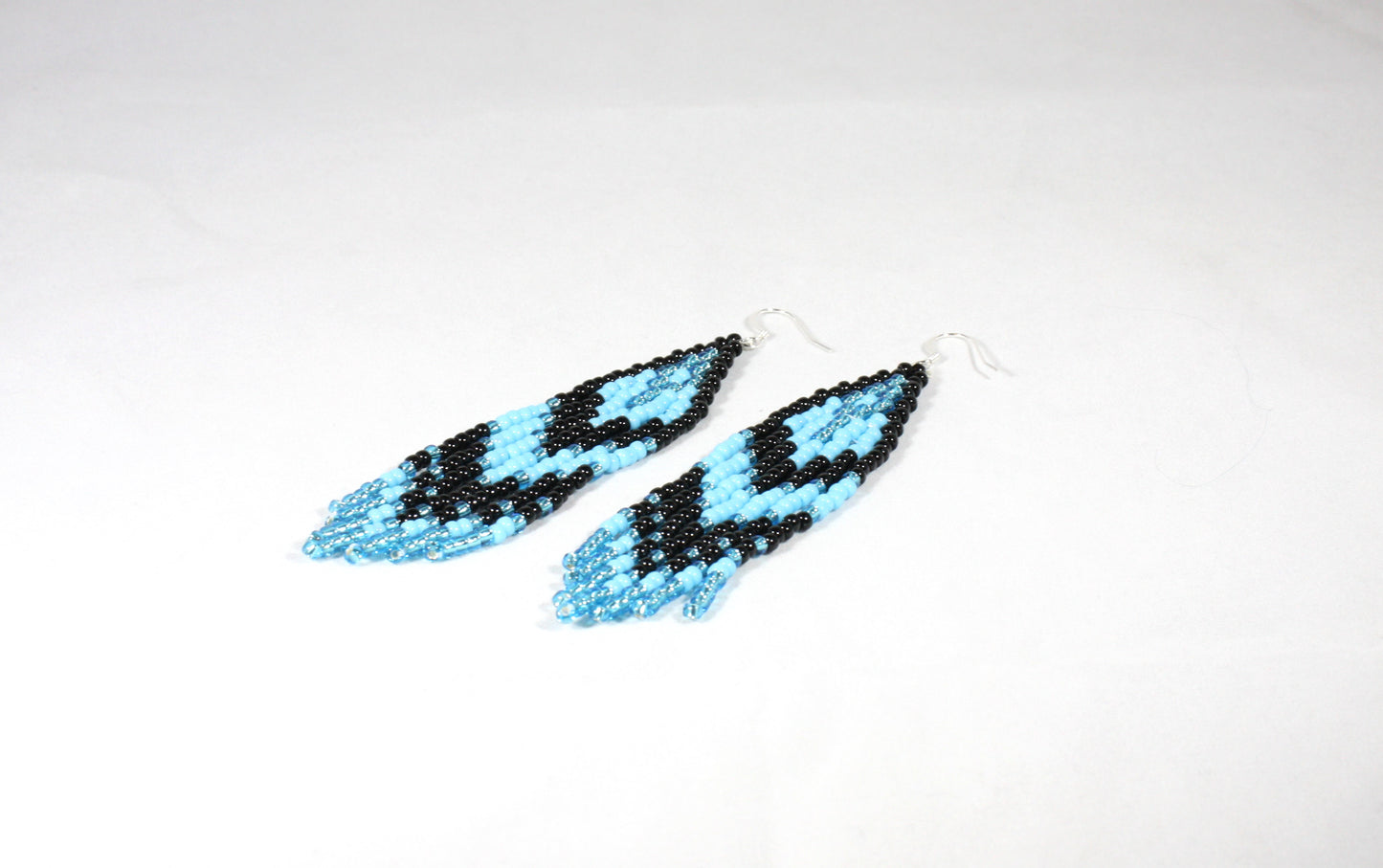 Handwoven fringe seed bead earrings light blue