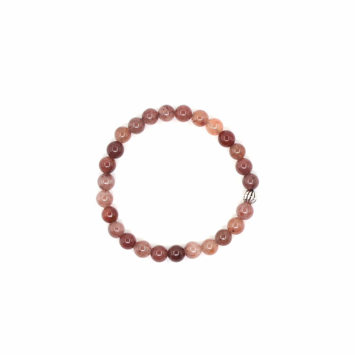 Aventuriini rannekoru valkoisella alustalla. Aventurine stretchy bracelet on the white surface.