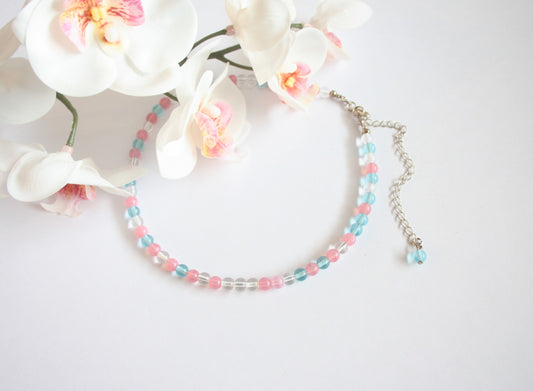 Glass bead choker necklace pink, light blue and bright colors. Beads are 6 mm. Lasihelmi choker (kaulapanta) kaulakoru. Monivärinen, jossa värit ovat vaaleanpunainen (pinkki), vaaleansininen ja kirkas. Helmet ovat 6 mm kokoisia.