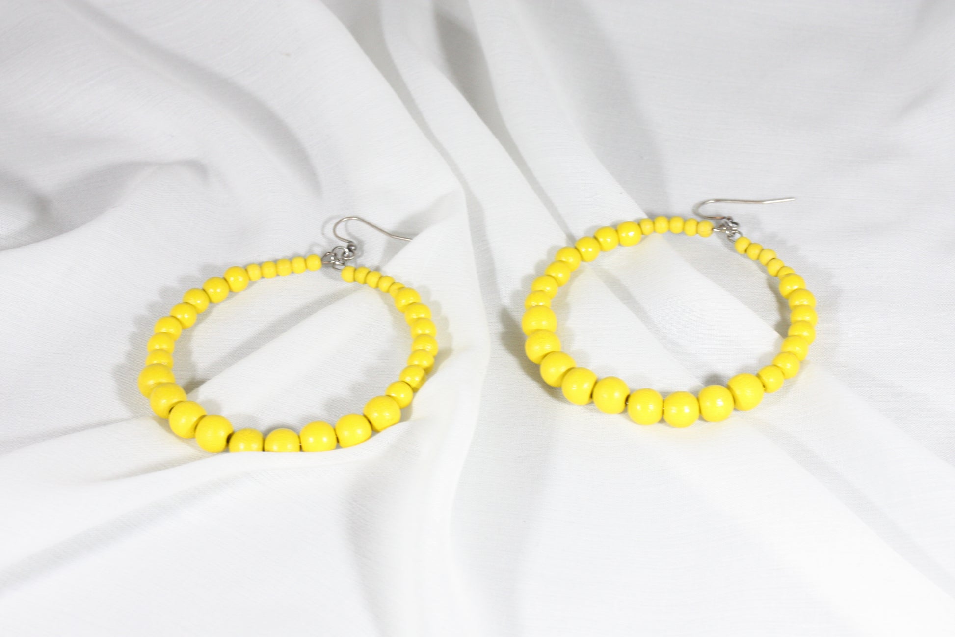 Wooden hoop earrings yellow.