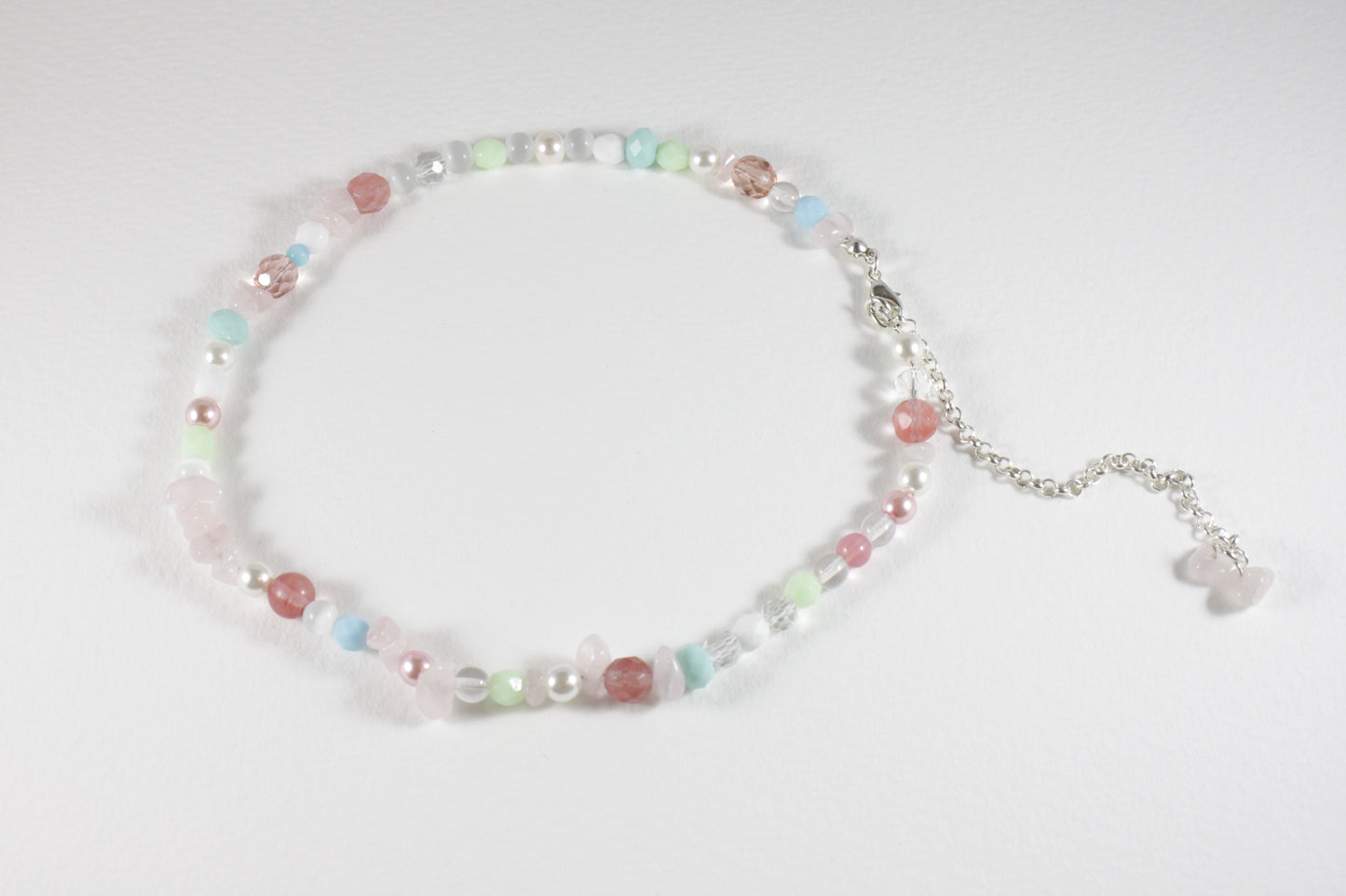 Rose quartz chips choker necklace with different glass beads pastel colors and silver color clasp and chain.