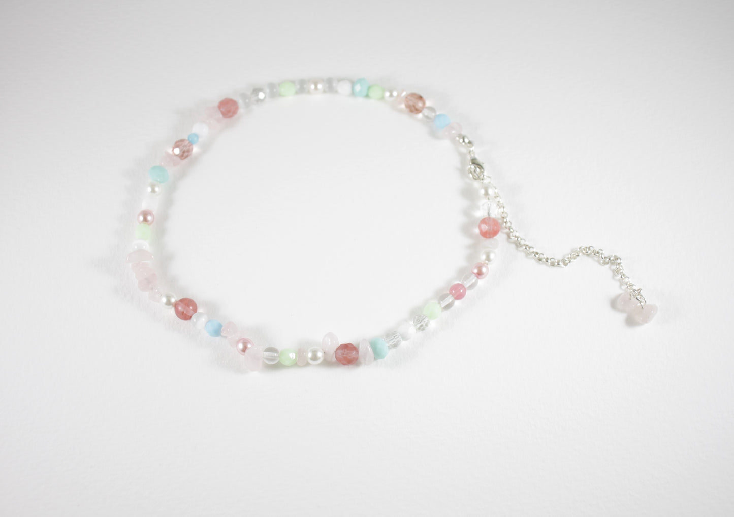 Rose quartz chips choker necklace with different glass beads pastel colors and silver color clasp and chain.