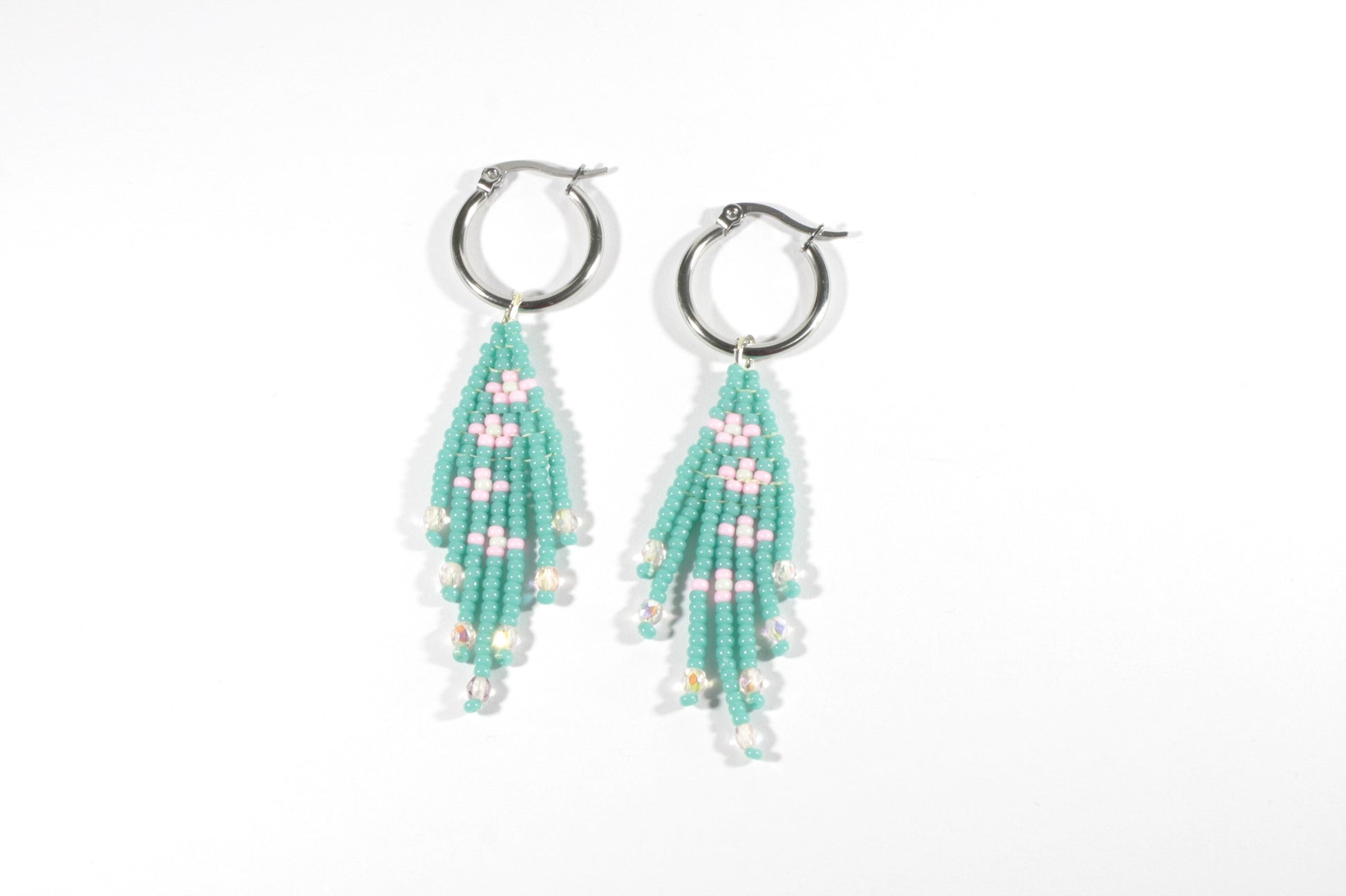 Seed bead fringe earrings small daisies. Color is turquoise and daisies are pink with mint color center. Hoops are stainless steel.