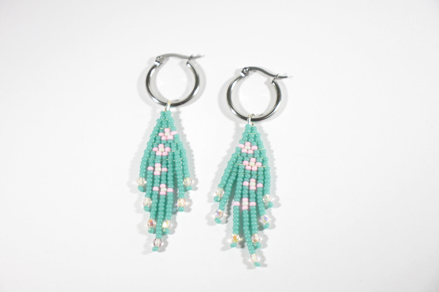 Seed bead fringe earrings small daisies. Color is turquoise and daisies are pink with mint color center. Hoops are stainless steel.