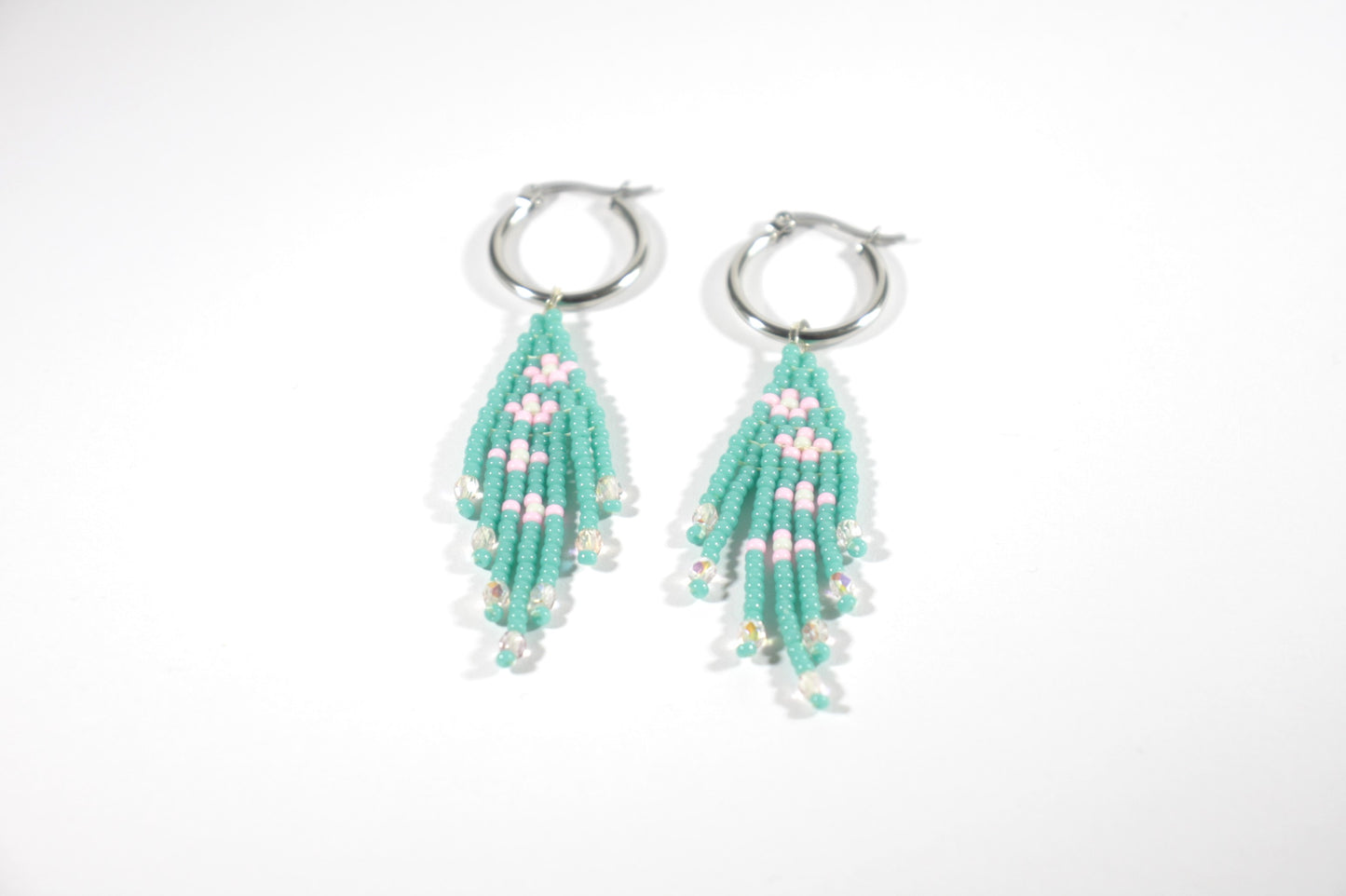 Seed bead fringe earrings small daisies. Color is turquoise and daisies are pink with mint color center. Hoops are stainless steel.