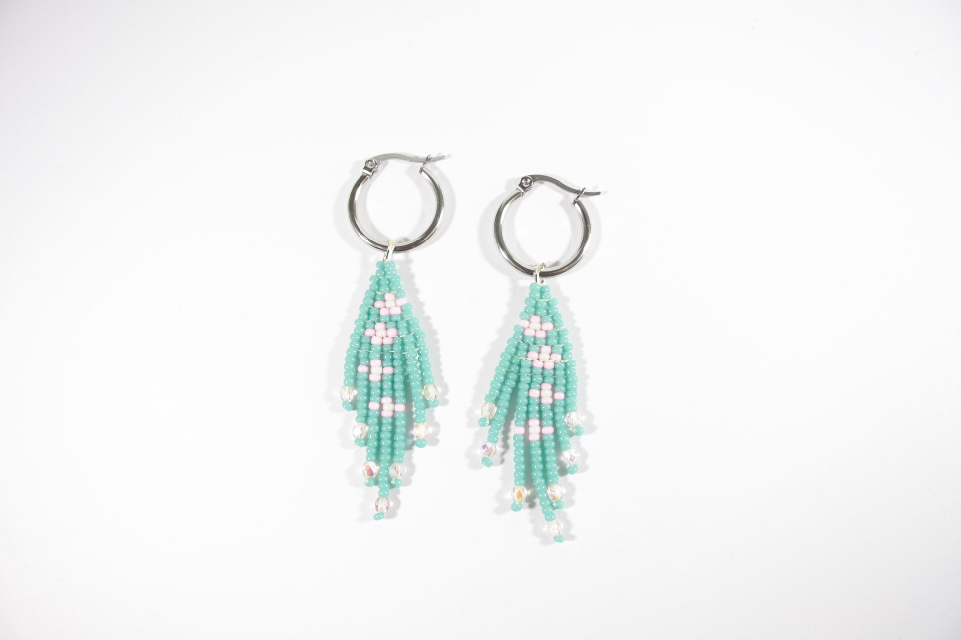 Seed bead fringe earrings small daisies. Color is turquoise and daisies are pink with mint color center. Hoops are stainless steel.