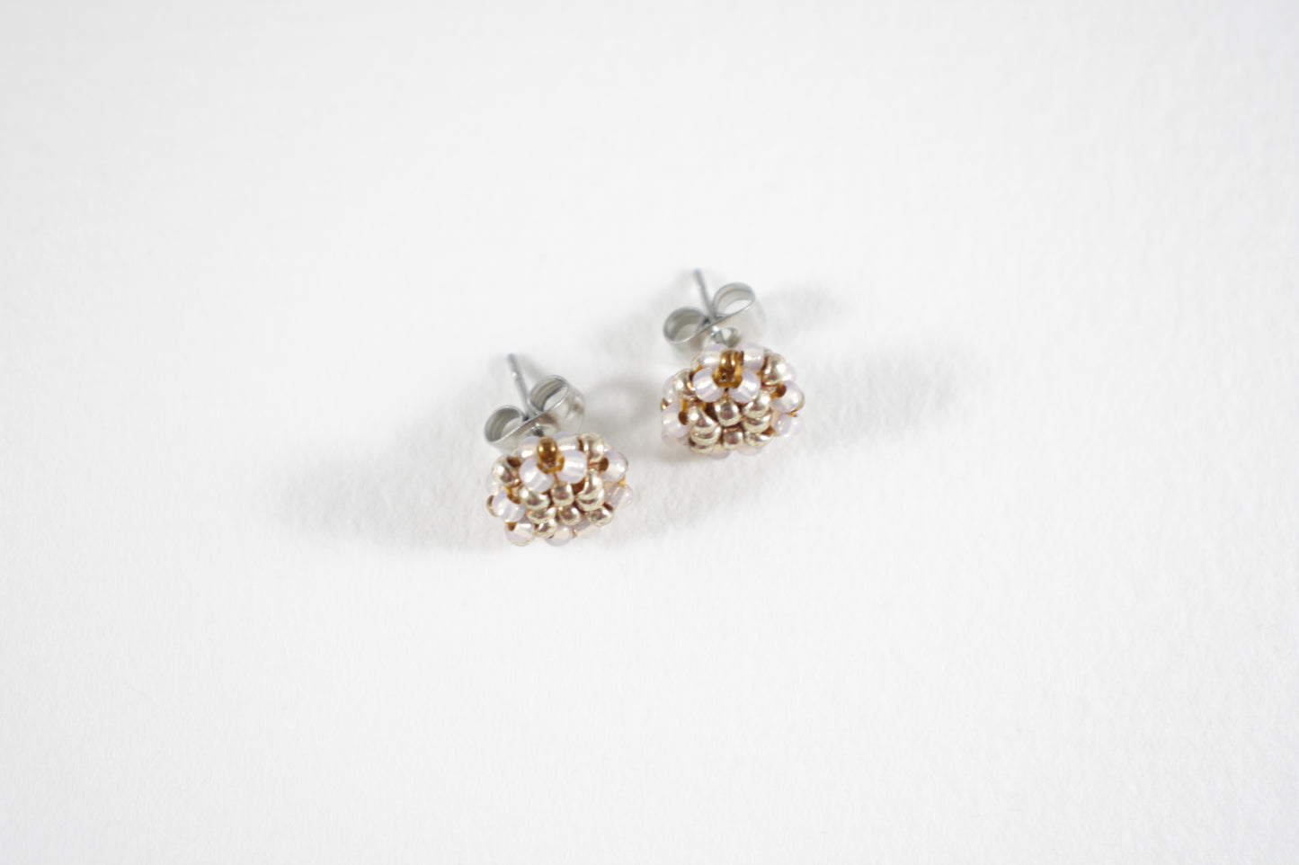 Glass bead stud earrings champagne and silver colors with stainless steel stud.