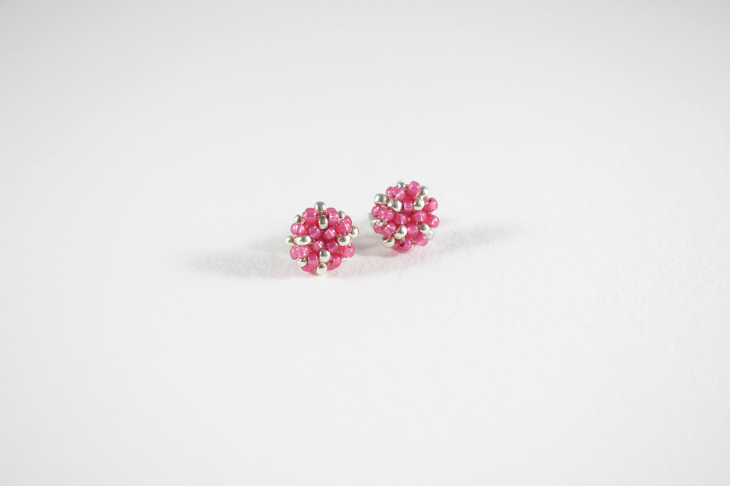 Seed bead stud earrings raspberry pink and silver color with stainless steel stud.