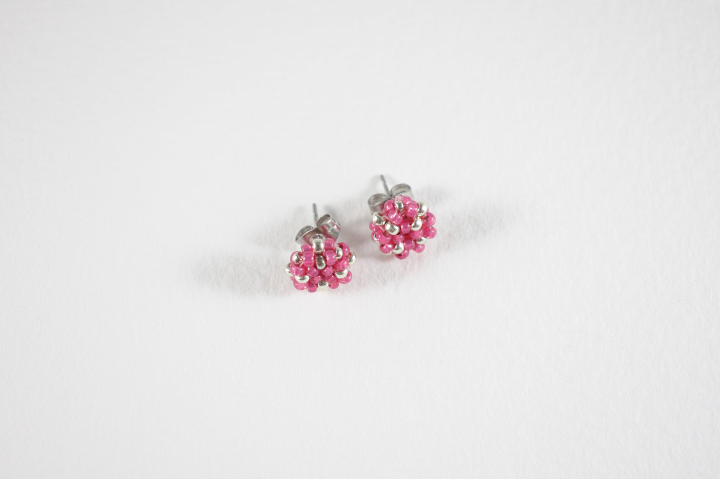 Seed bead stud earrings raspberry pink and silver color with stainless steel stud.