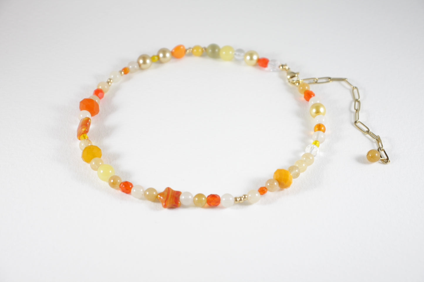 Sitrine beads size of 6 mm and different size of glass beads choker necklace orange and yellow colors. Clasp and extension chains are gold colors. 